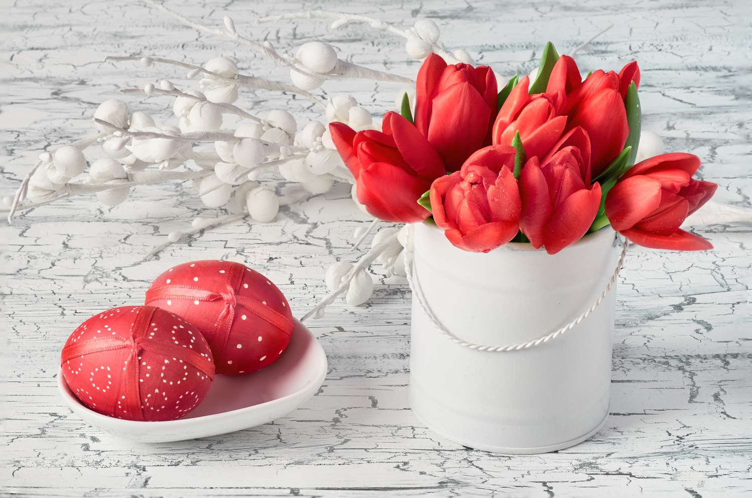Red tulips and red Easter eggs holiday centerpiece